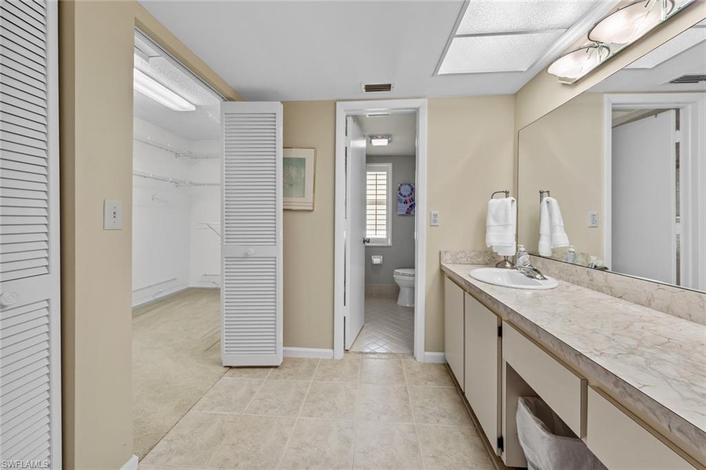 273 Albi Road, Unit 4 Naples, FL 34112 - Photo 24 of 50 Bathroom with tile patterned flooring, vanity, and toilet