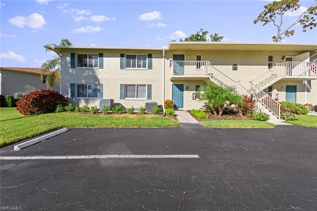 273 Albi Road, Unit 4 Naples, FL 34112 - Photo 34 of 50 View of property featuring central AC unit