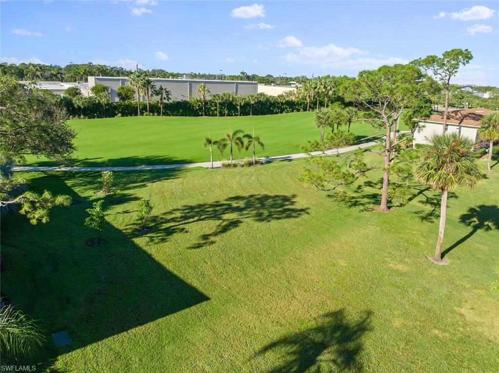 273 Albi Road, Unit 4 Naples, FL 34112 - Photo 41 of 50 View of property's community featuring a yard