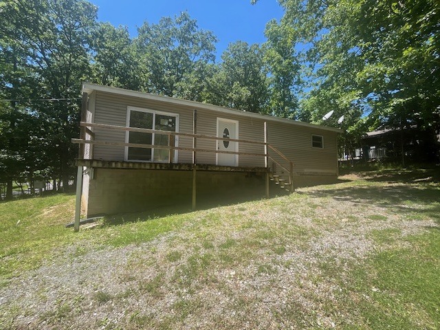 35 Sandy Point Goreville, IL 62939 - Photo 2 of 8 a backyard of a house with lots of green space