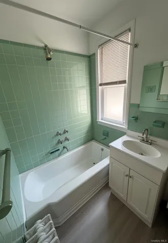 a bathroom with a sink a toilet and bathtub