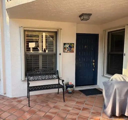 a view of outdoor space with porch and wooden floor