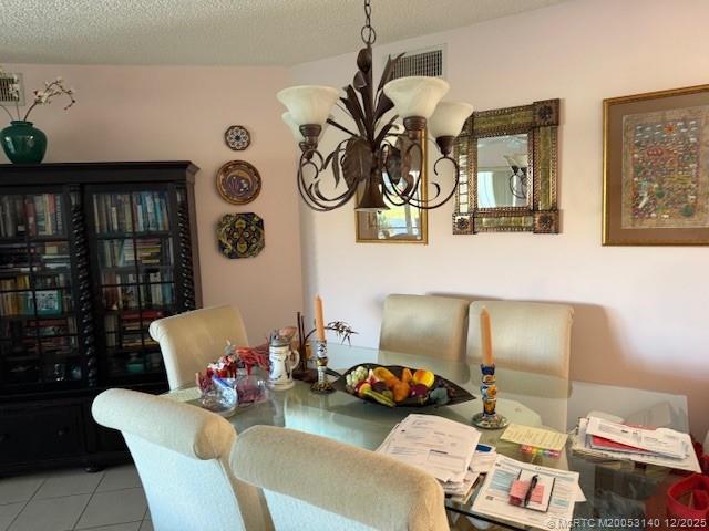 3480 Southeast Martinique Trace, Unit 102 Stuart, FL 34997 - Photo 12 of 24 a living room with furniture and wall paintings