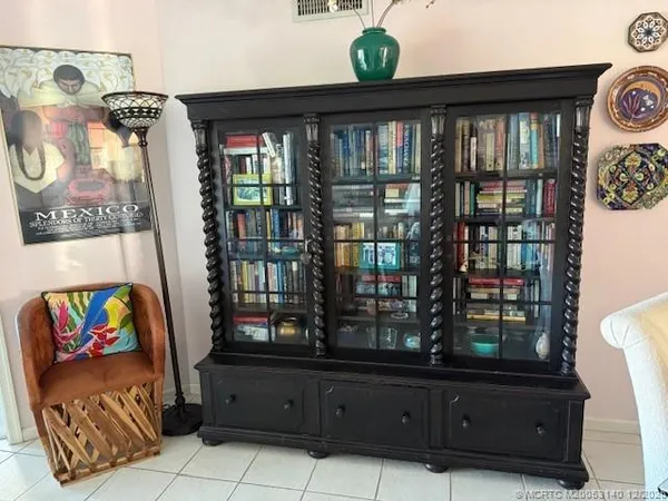 a bed sitting in a bedroom next to a couch