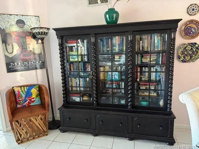 a bed sitting in a bedroom next to a couch