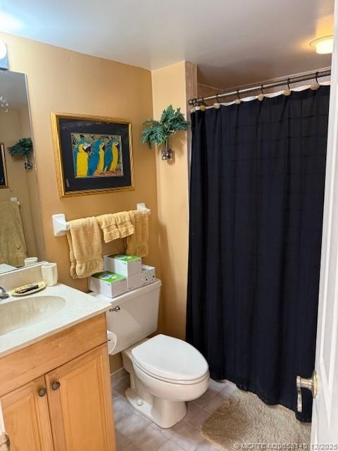 3480 Southeast Martinique Trace, Unit 102 Stuart, FL 34997 - Photo 18 of 24 a bathroom with a sink and a toilet