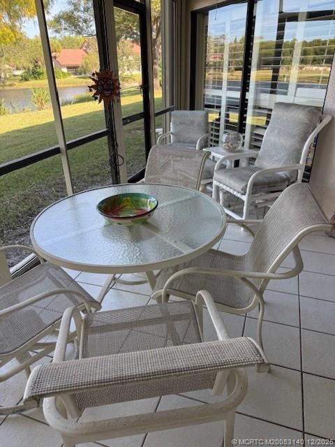 3480 Southeast Martinique Trace, Unit 102 Stuart, FL 34997 - Photo 21 of 24 a view of a dining room with furniture window and outside view
