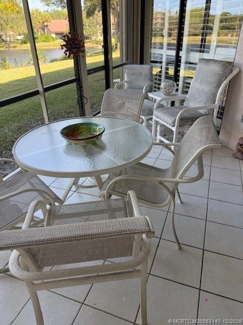 3480 Southeast Martinique Trace, Unit 102 Stuart, FL 34997 - Photo 22 of 24 a backyard of a house with outdoor seating