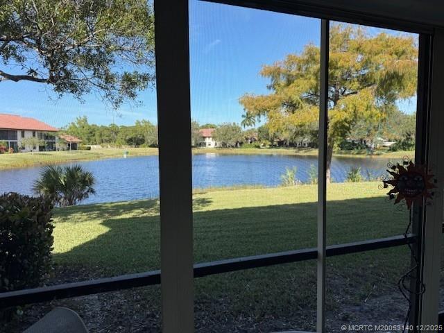 3480 Southeast Martinique Trace, Unit 102 Stuart, FL 34997 - Photo 23 of 24 a view of a lake from a window