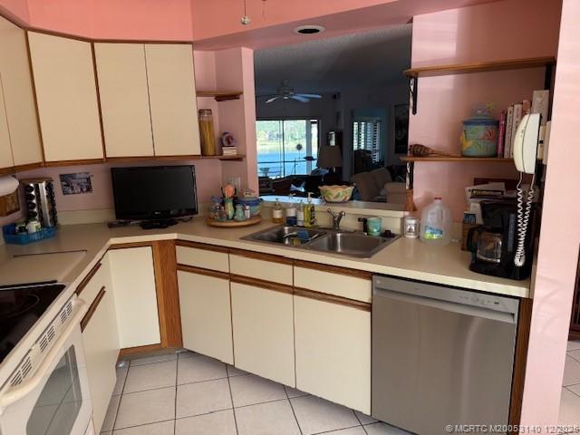 3480 Southeast Martinique Trace, Unit 102 Stuart, FL 34997 - Photo 8 of 24 a kitchen with a sink and cabinets
