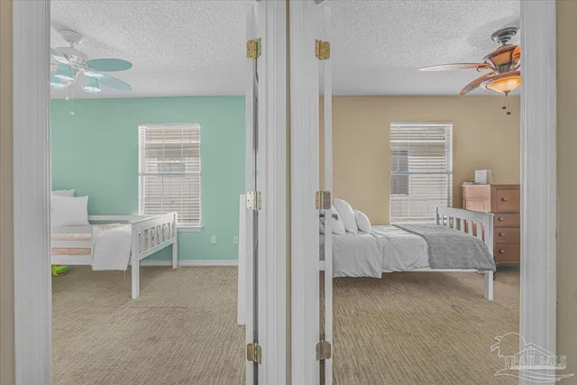 a bedroom with a bed and a couch