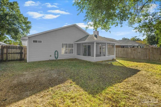 an aerial view of a house with a yard basket ball court and outdoor seating