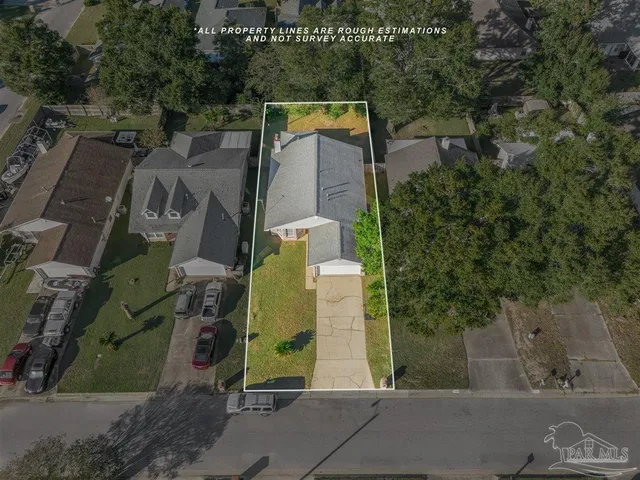 an aerial view of residential house with outdoor space