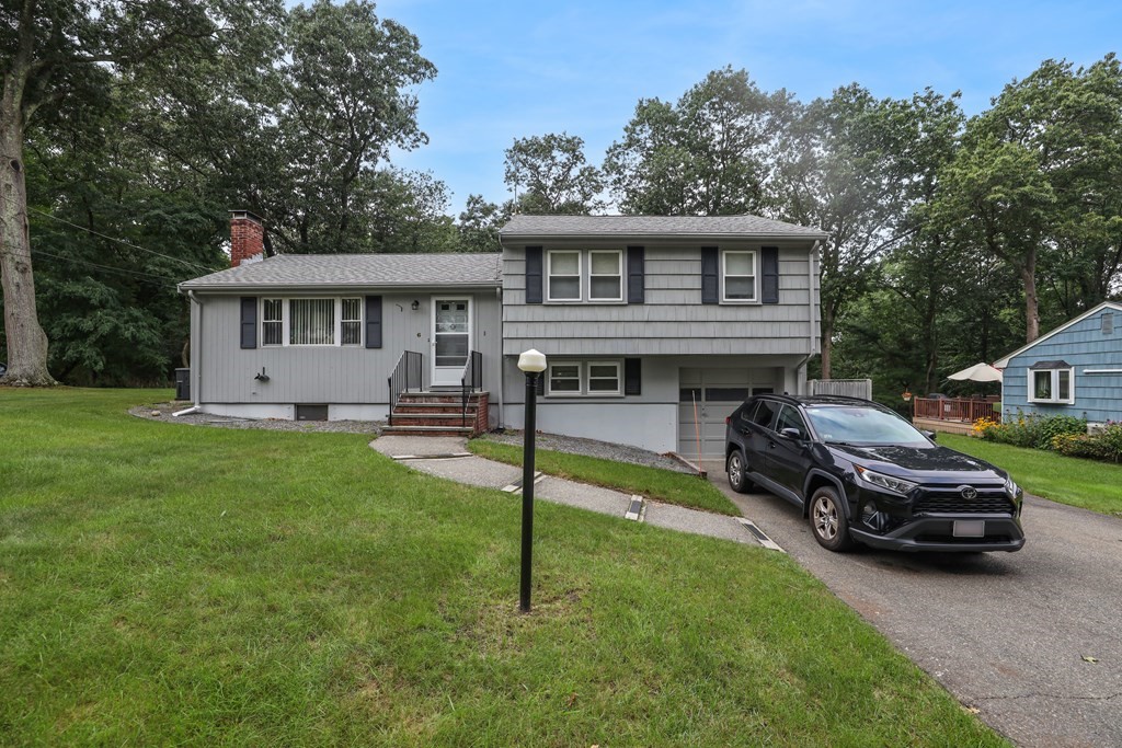 6 Roach Road Stoughton, MA 02072 - Photo 3 of 26 a house view with a garden space