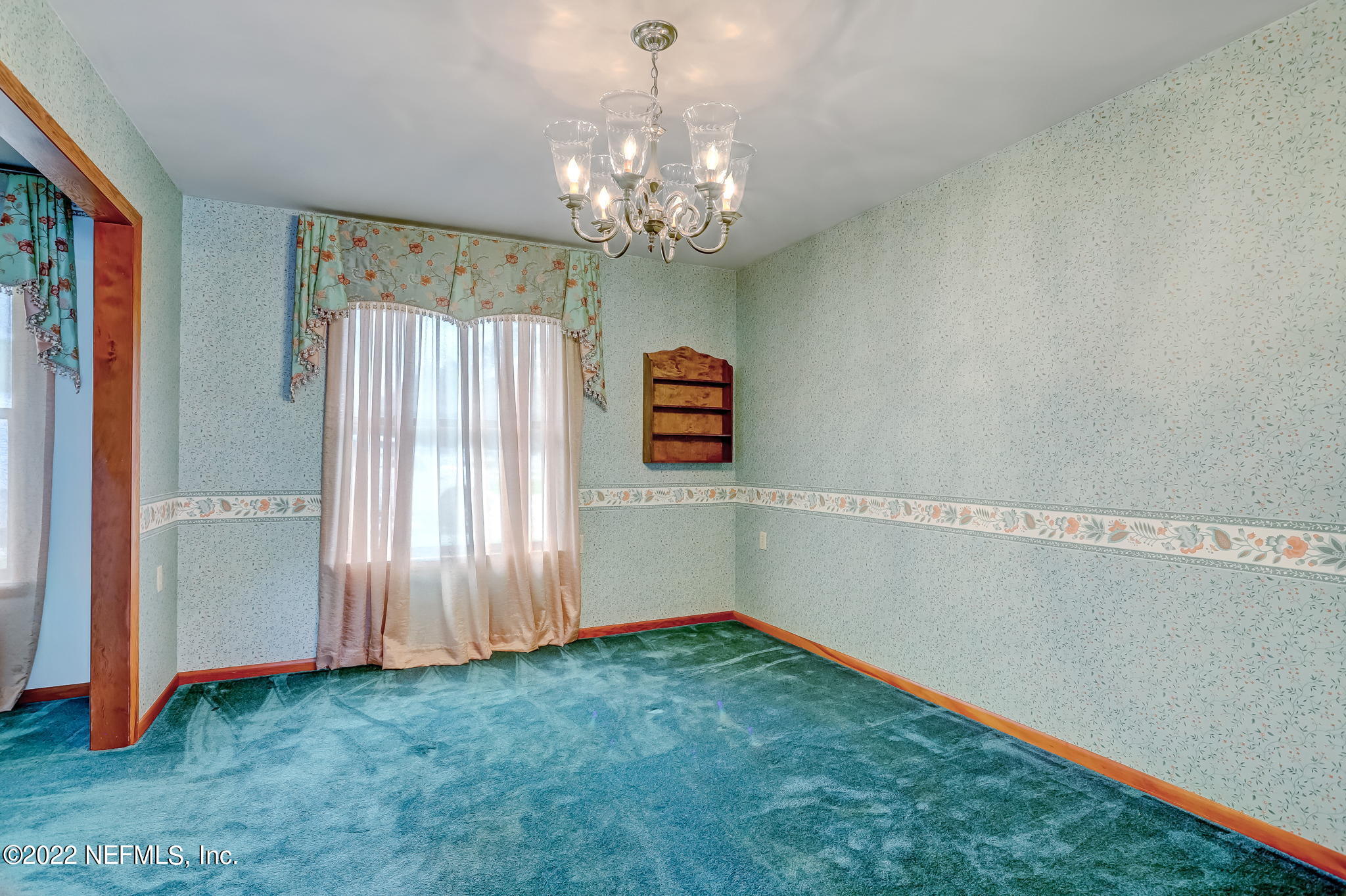 11643 Olde Mandarin Road Jacksonville, FL 32223 - Photo 19 of 70 a view of a hallway with chandelier and entryway