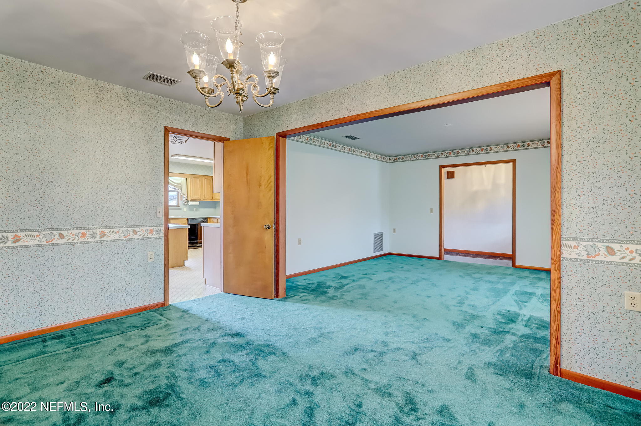 11643 Olde Mandarin Road Jacksonville, FL 32223 - Photo 21 of 70 a view of a big room with windows and chandelier
