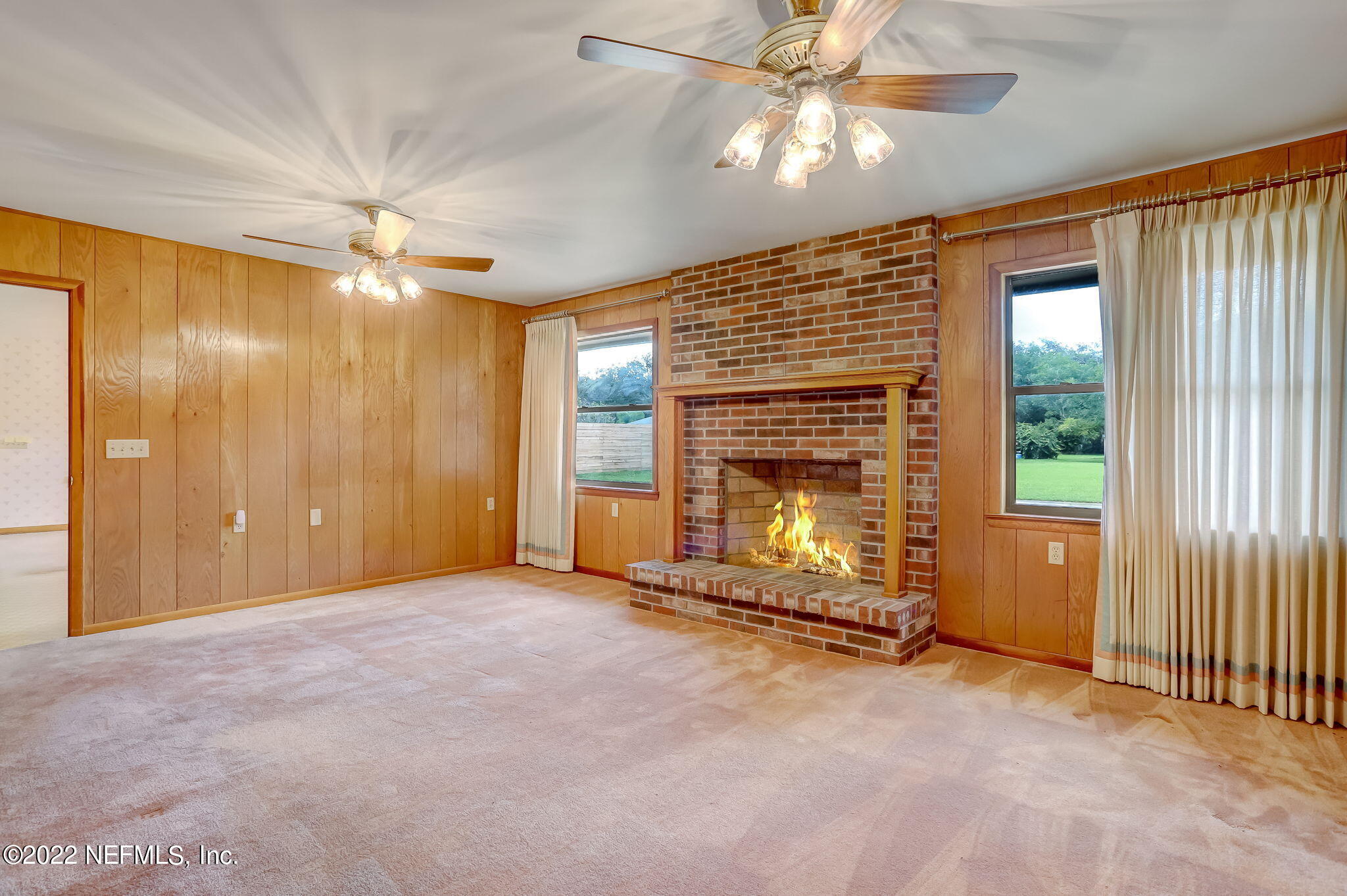 11643 Olde Mandarin Road Jacksonville, FL 32223 - Photo 23 of 70 a view of an empty room with window chandelier fan