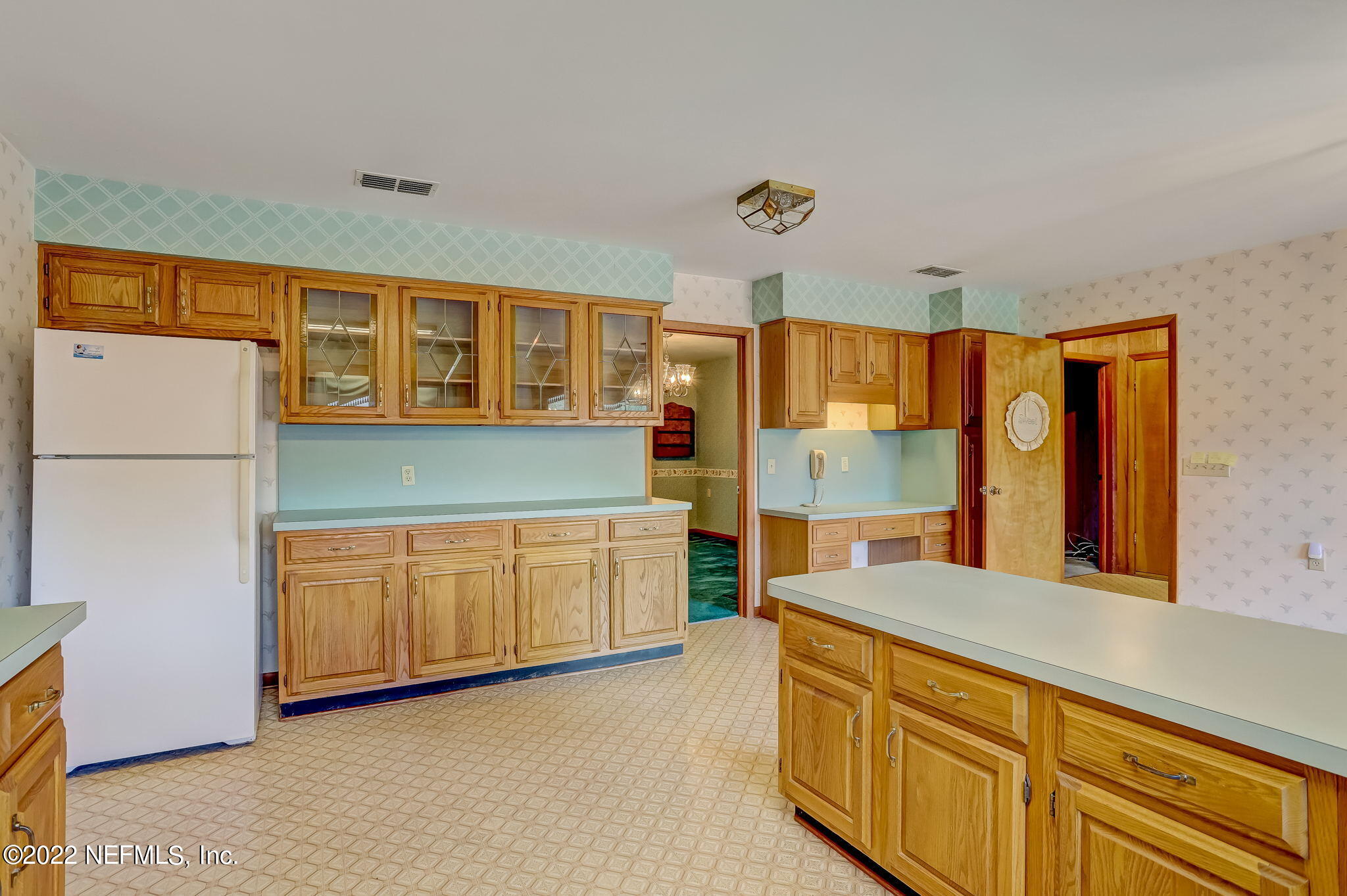 11643 Olde Mandarin Road Jacksonville, FL 32223 - Photo 32 of 70 a kitchen with stainless steel appliances granite countertop a refrigerator sink and cabinets