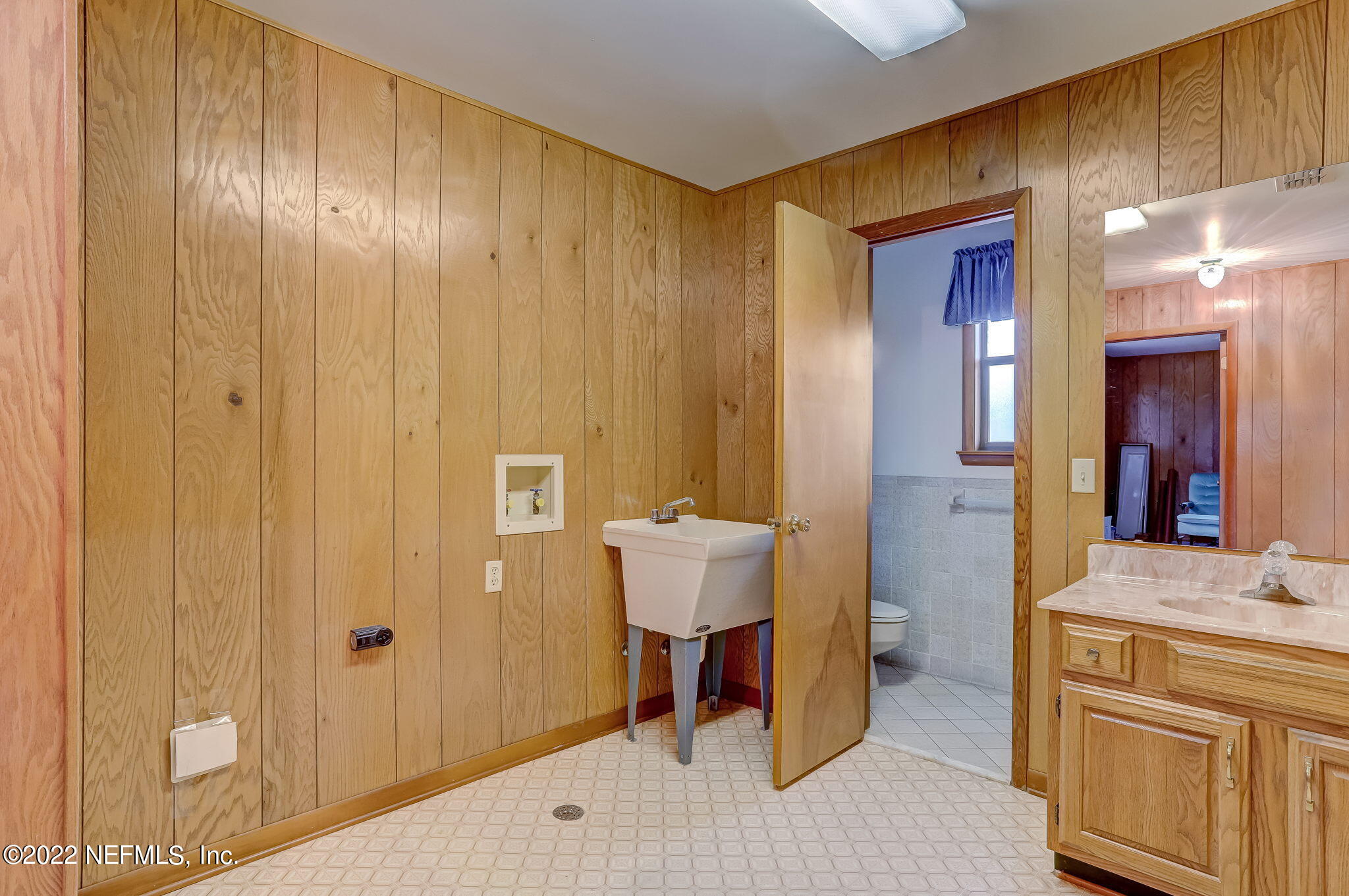 11643 Olde Mandarin Road Jacksonville, FL 32223 - Photo 37 of 70 a bathroom with a sink and a mirror