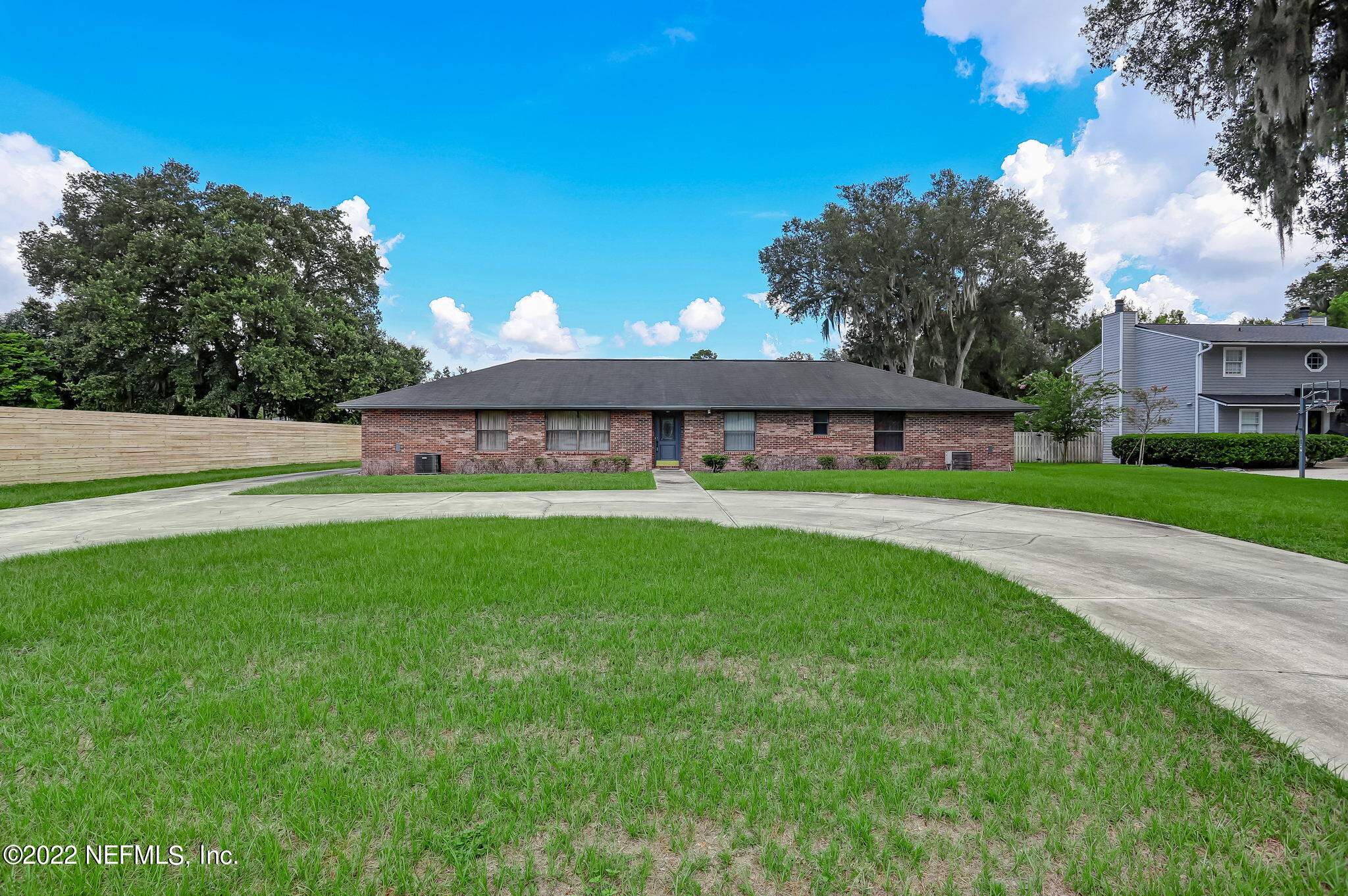 11643 Olde Mandarin Road Jacksonville, FL 32223 - Photo 4 of 70 a view of a house with a big yard