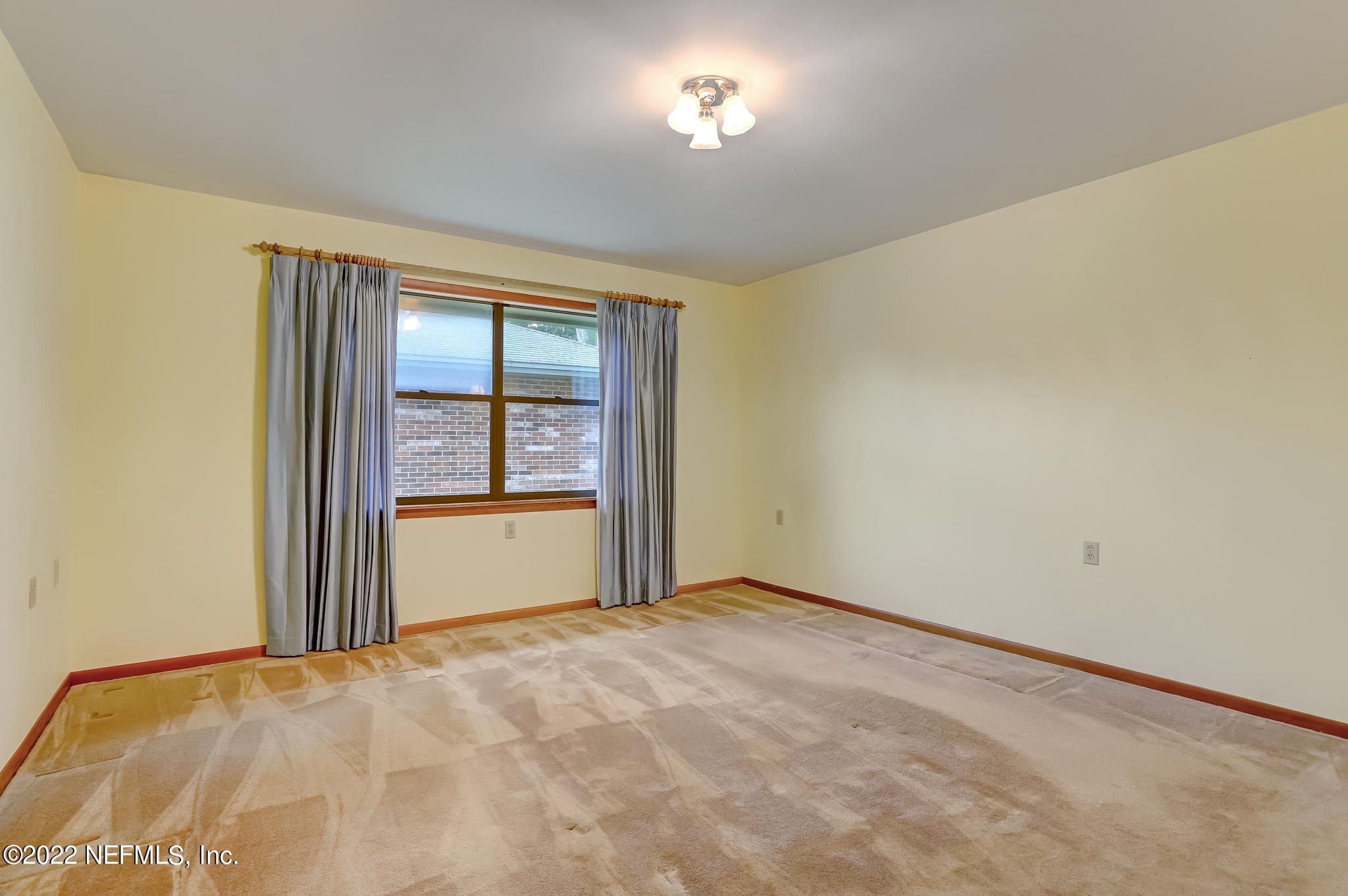 11643 Olde Mandarin Road Jacksonville, FL 32223 - Photo 41 of 70 an empty room with a window