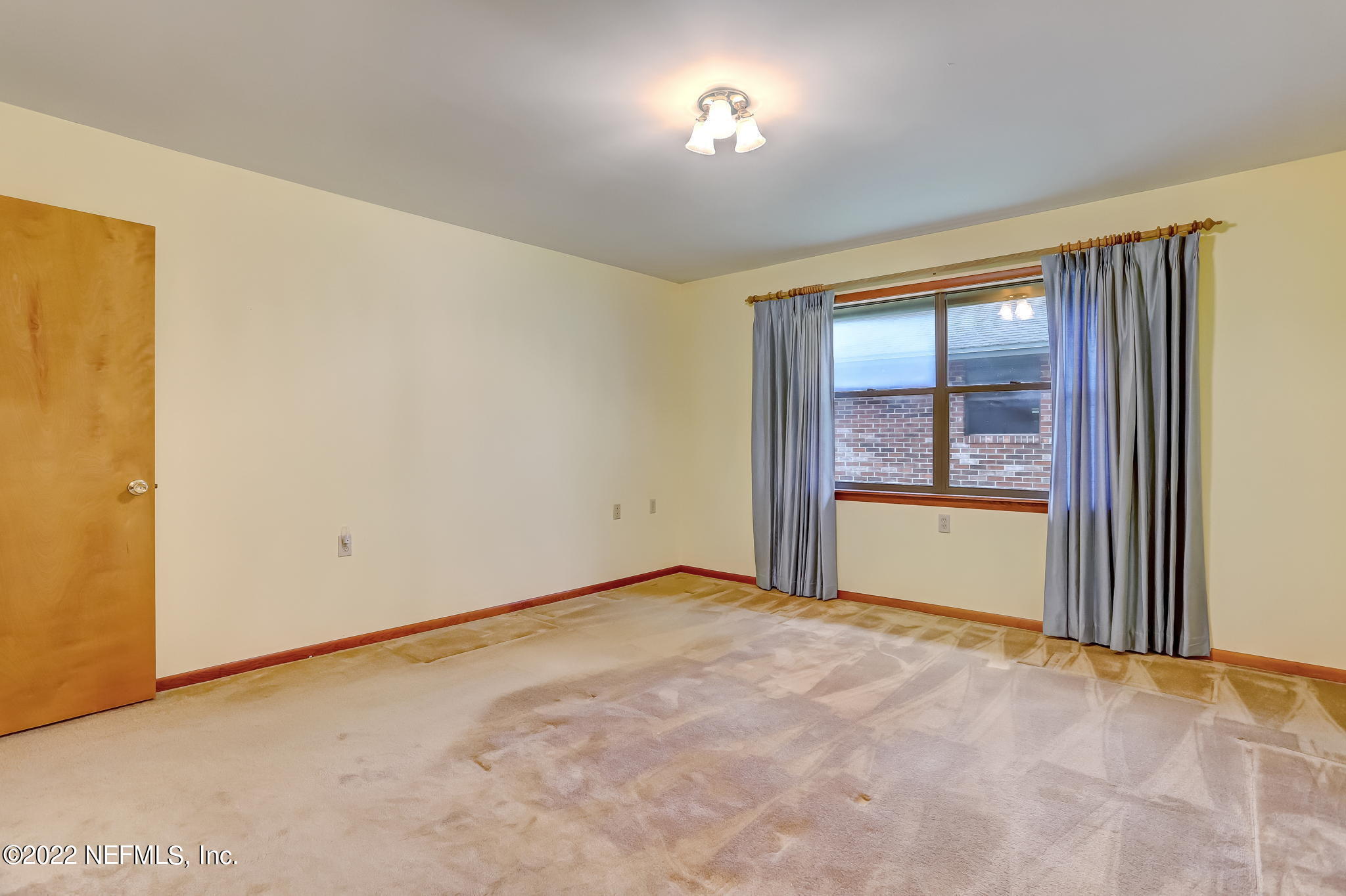 11643 Olde Mandarin Road Jacksonville, FL 32223 - Photo 42 of 70 a view of an empty room with a window