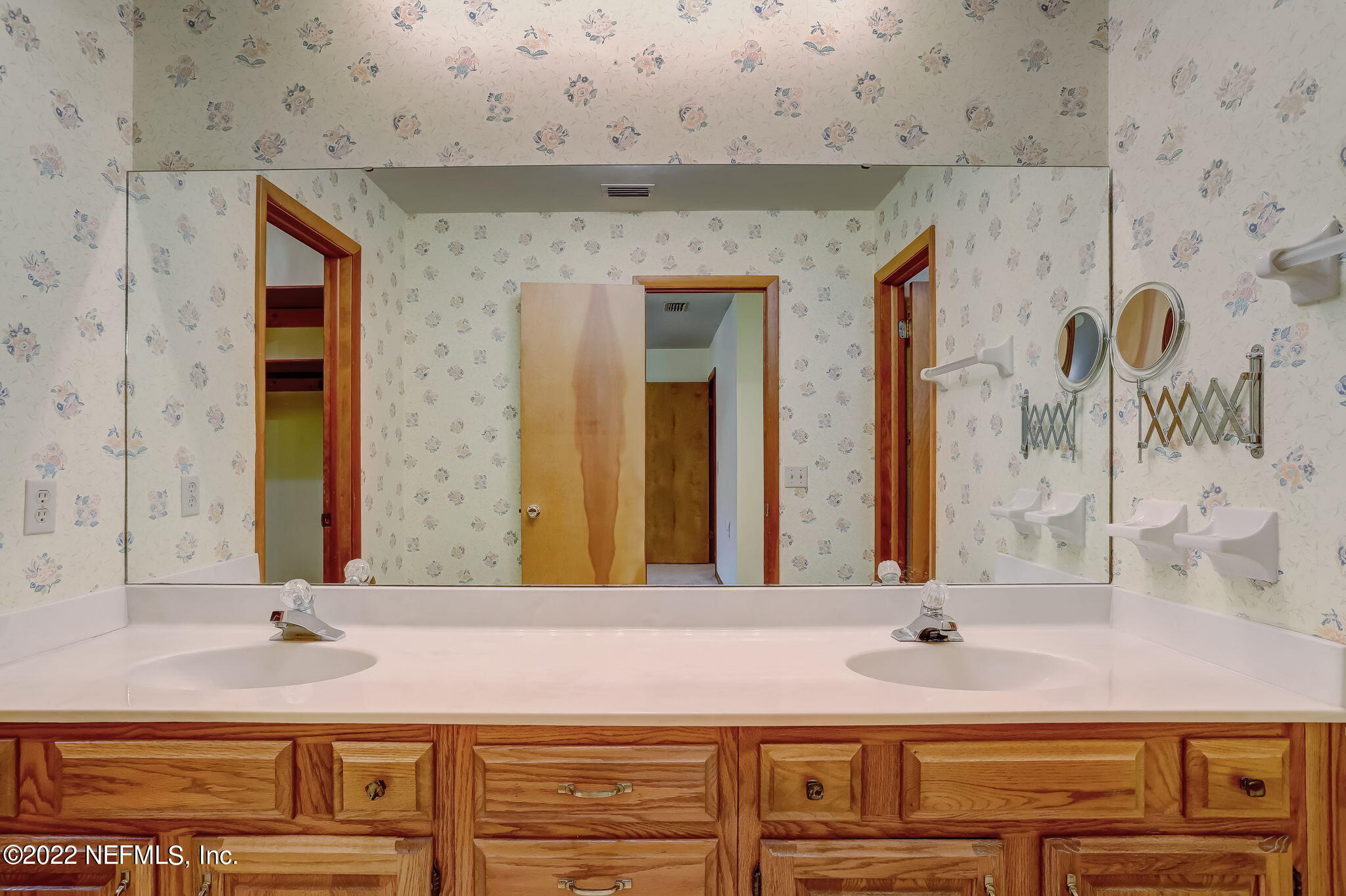 11643 Olde Mandarin Road Jacksonville, FL 32223 - Photo 45 of 70 a bathroom with a granite countertop sink and a mirror