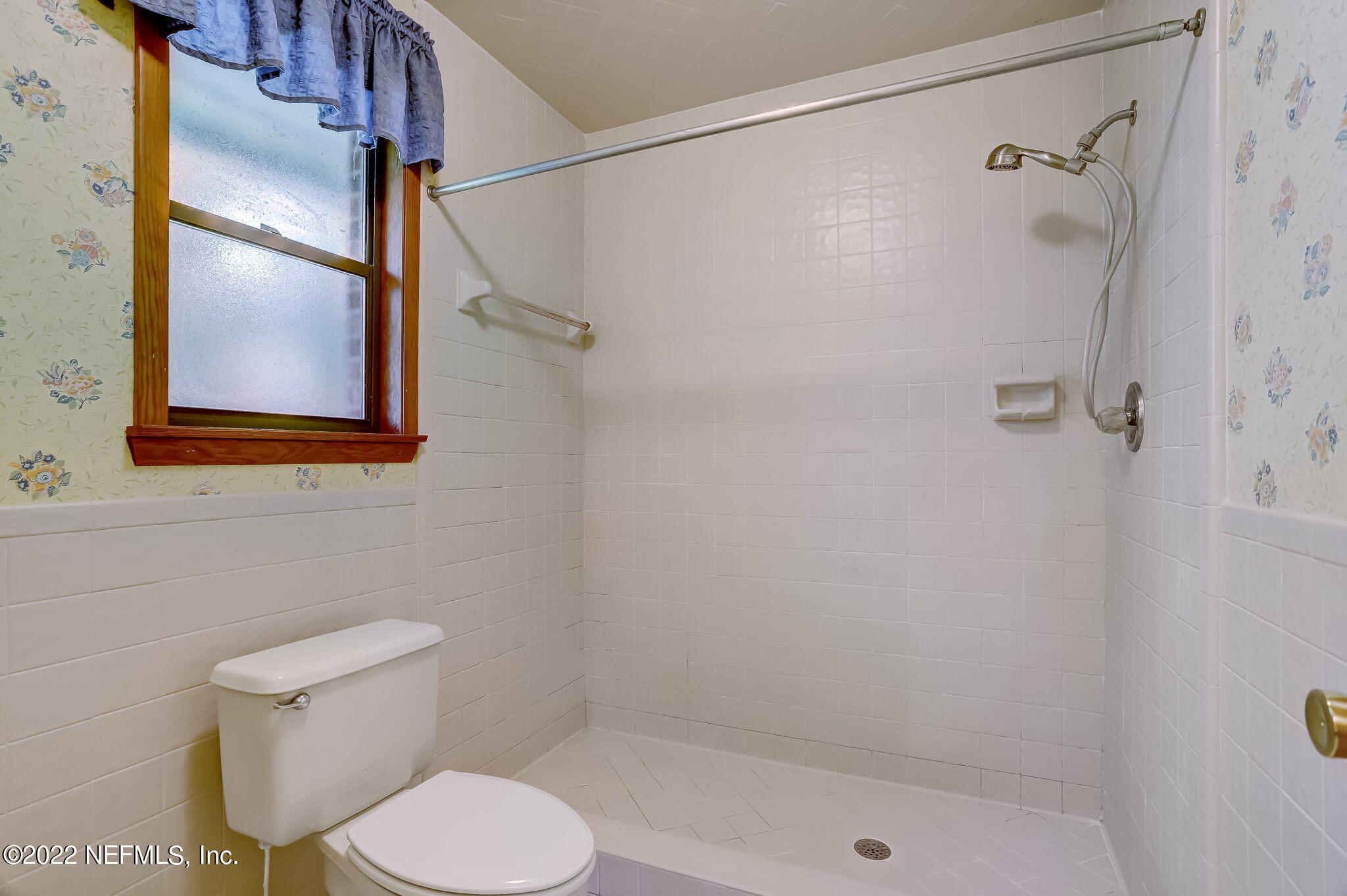 11643 Olde Mandarin Road Jacksonville, FL 32223 - Photo 47 of 70 a white toilet sitting next to a bath tub shower