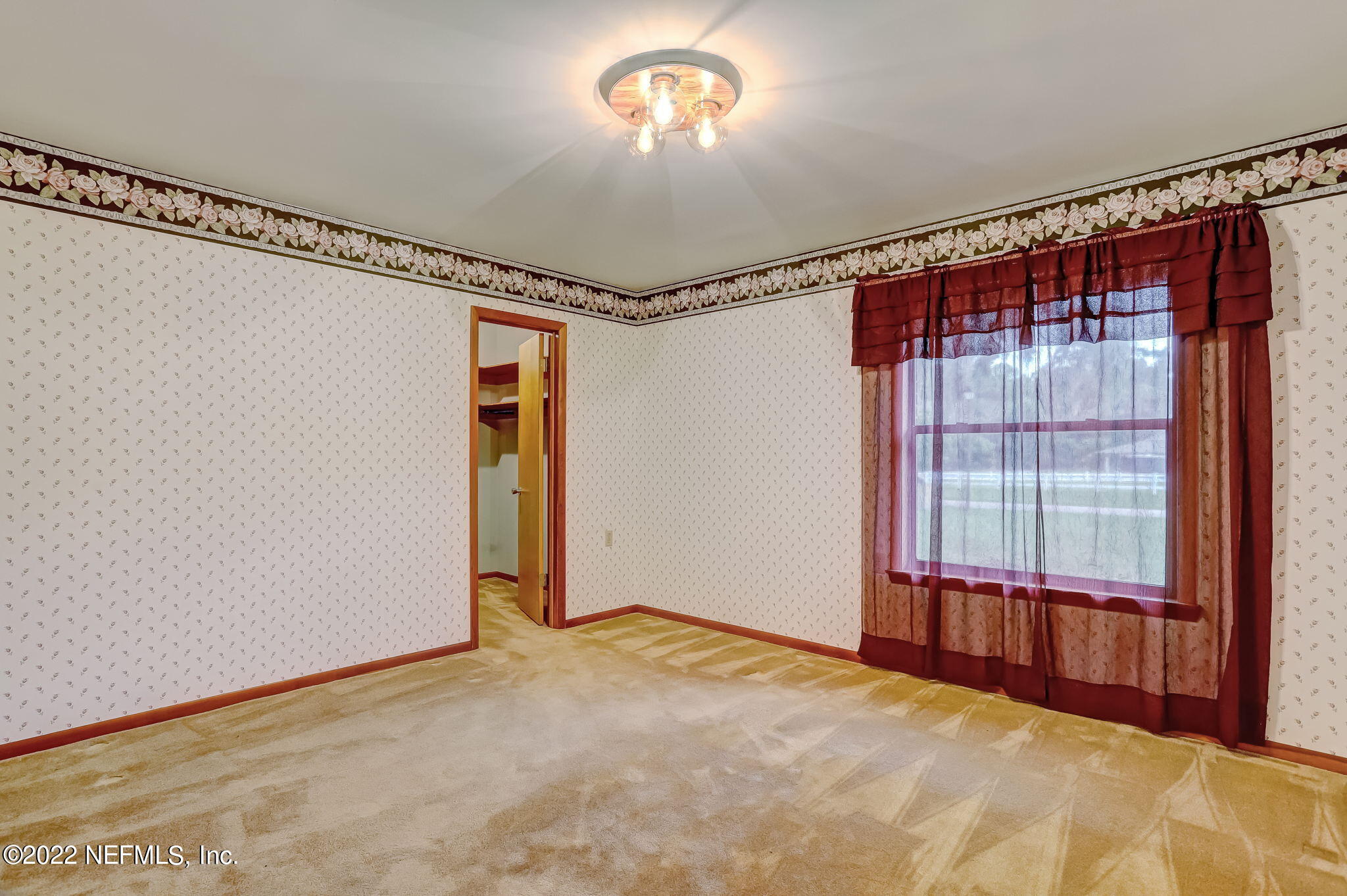 11643 Olde Mandarin Road Jacksonville, FL 32223 - Photo 49 of 70 a view of an empty room with a window