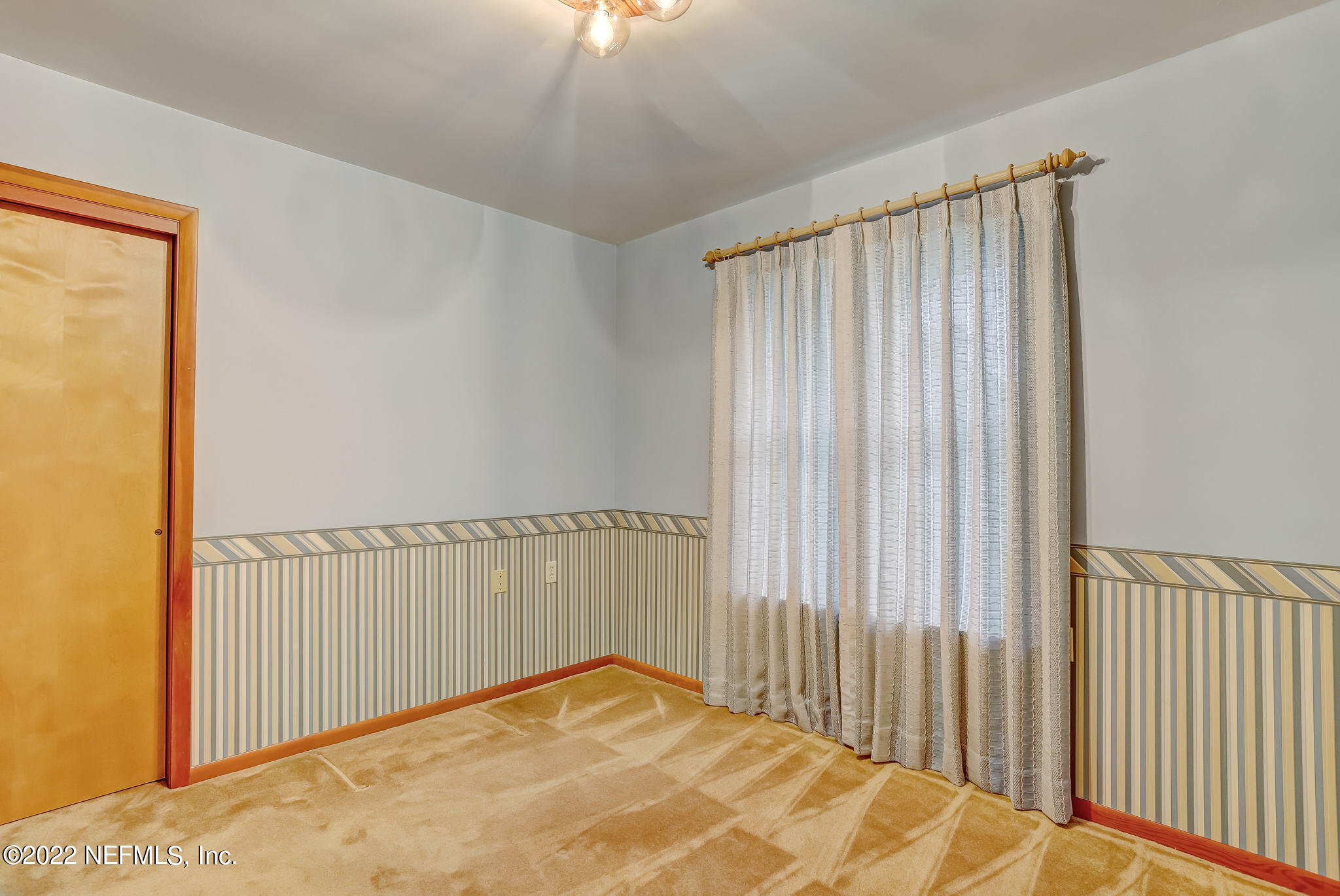 11643 Olde Mandarin Road Jacksonville, FL 32223 - Photo 54 of 70 a view of a room with a wooden floor and chair