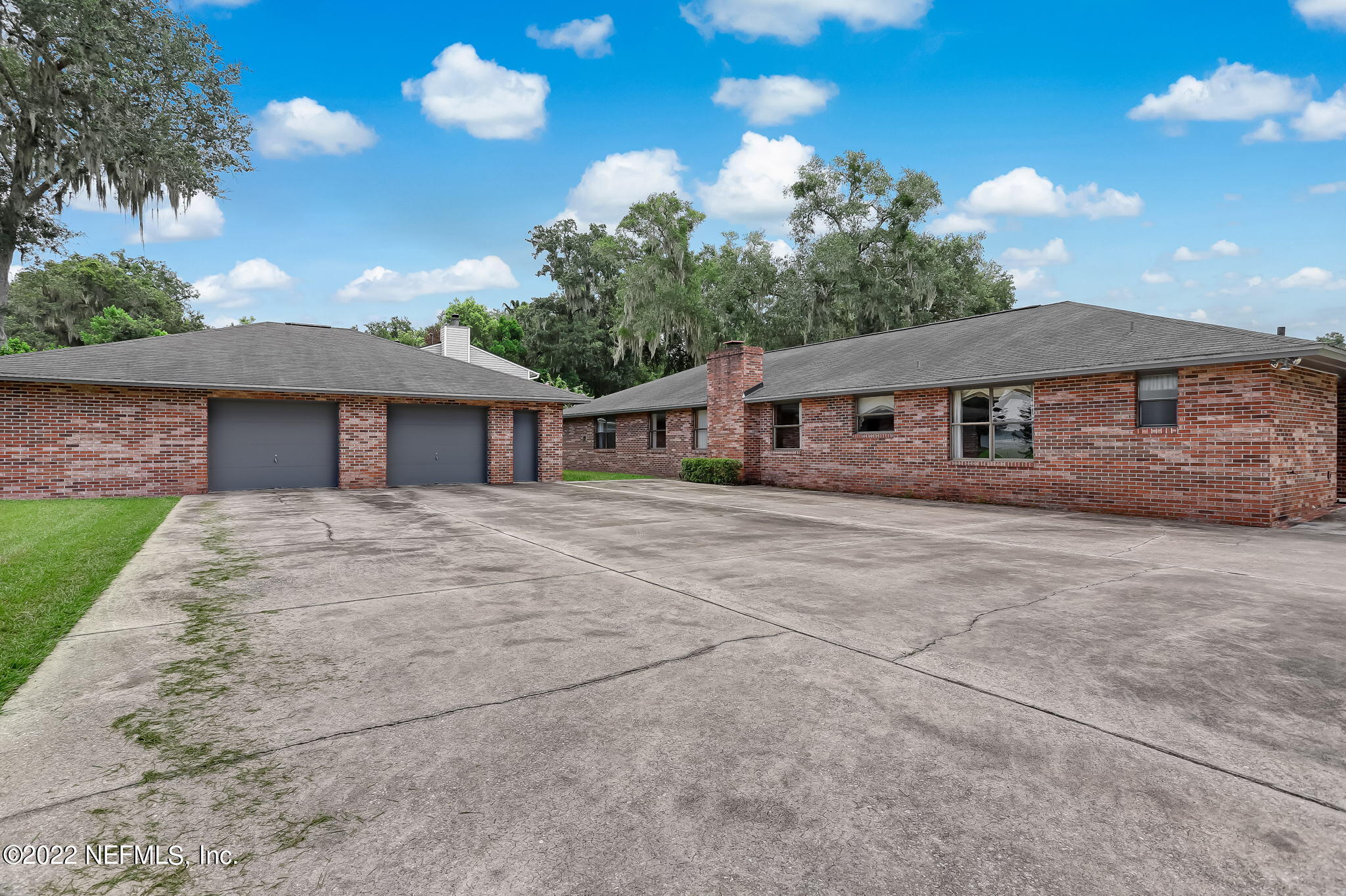 11643 Olde Mandarin Road Jacksonville, FL 32223 - Photo 62 of 70 a front view of a house with yard