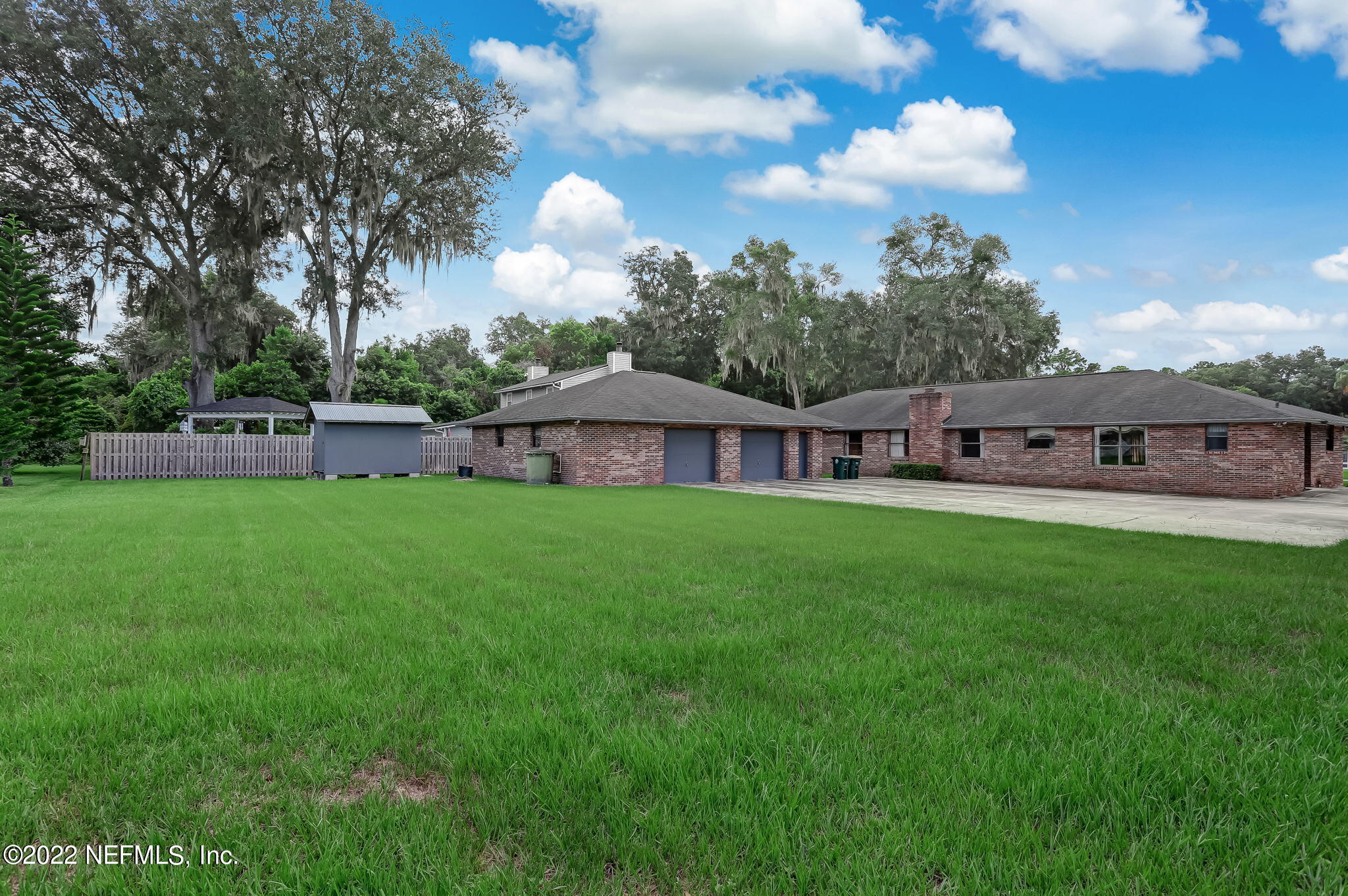 11643 Olde Mandarin Road Jacksonville, FL 32223 - Photo 64 of 70 a view of a house with a back yard