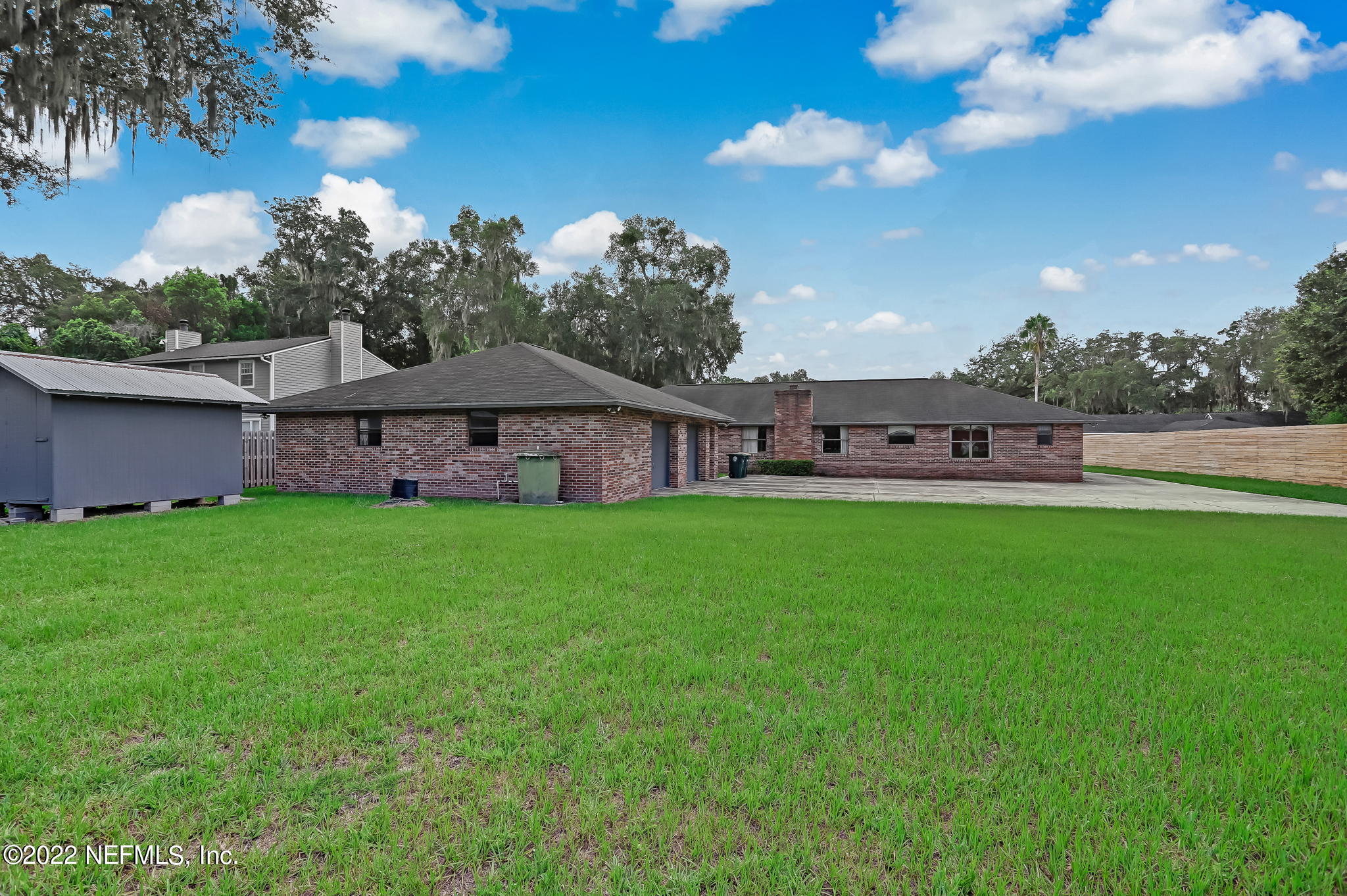 11643 Olde Mandarin Road Jacksonville, FL 32223 - Photo 65 of 70 a view of a house with a big yard with a large tree