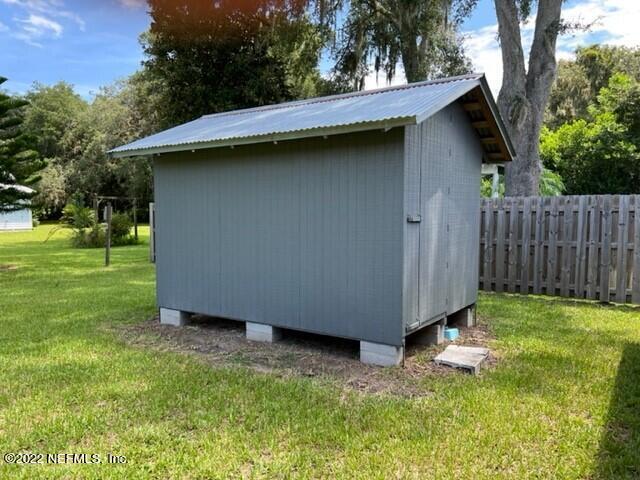 11643 Olde Mandarin Road Jacksonville, FL 32223 - Photo 68 of 70 a view of backyard with barbeque oven and trees