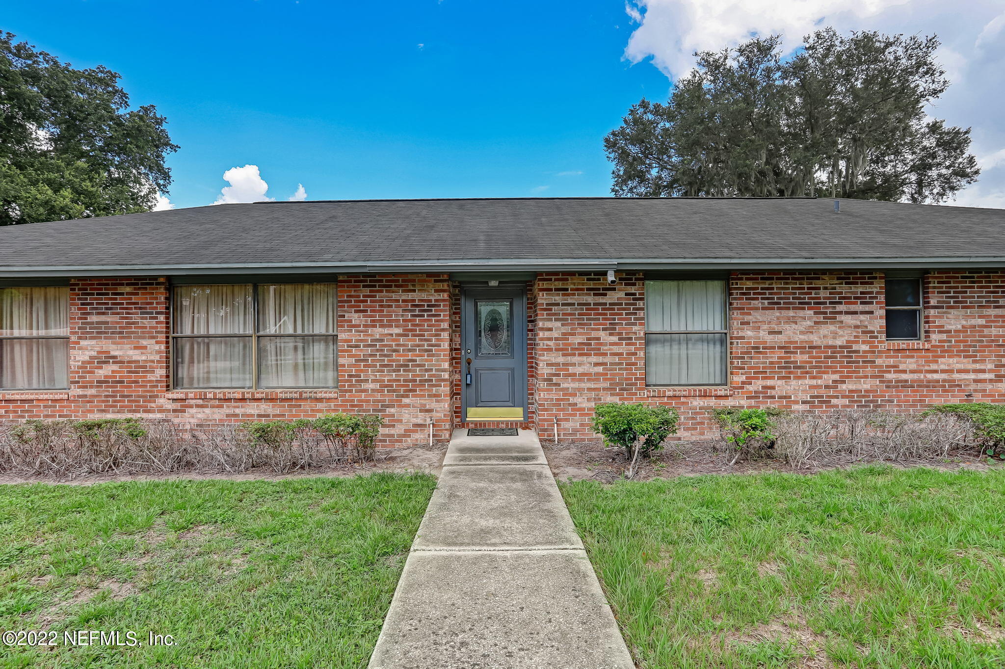11643 Olde Mandarin Road Jacksonville, FL 32223 - Photo 9 of 70 a front view of a house with garden