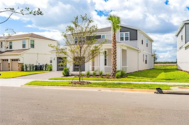 a front view of a house with a swimming pool