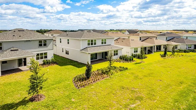 a view of a house with a big yard