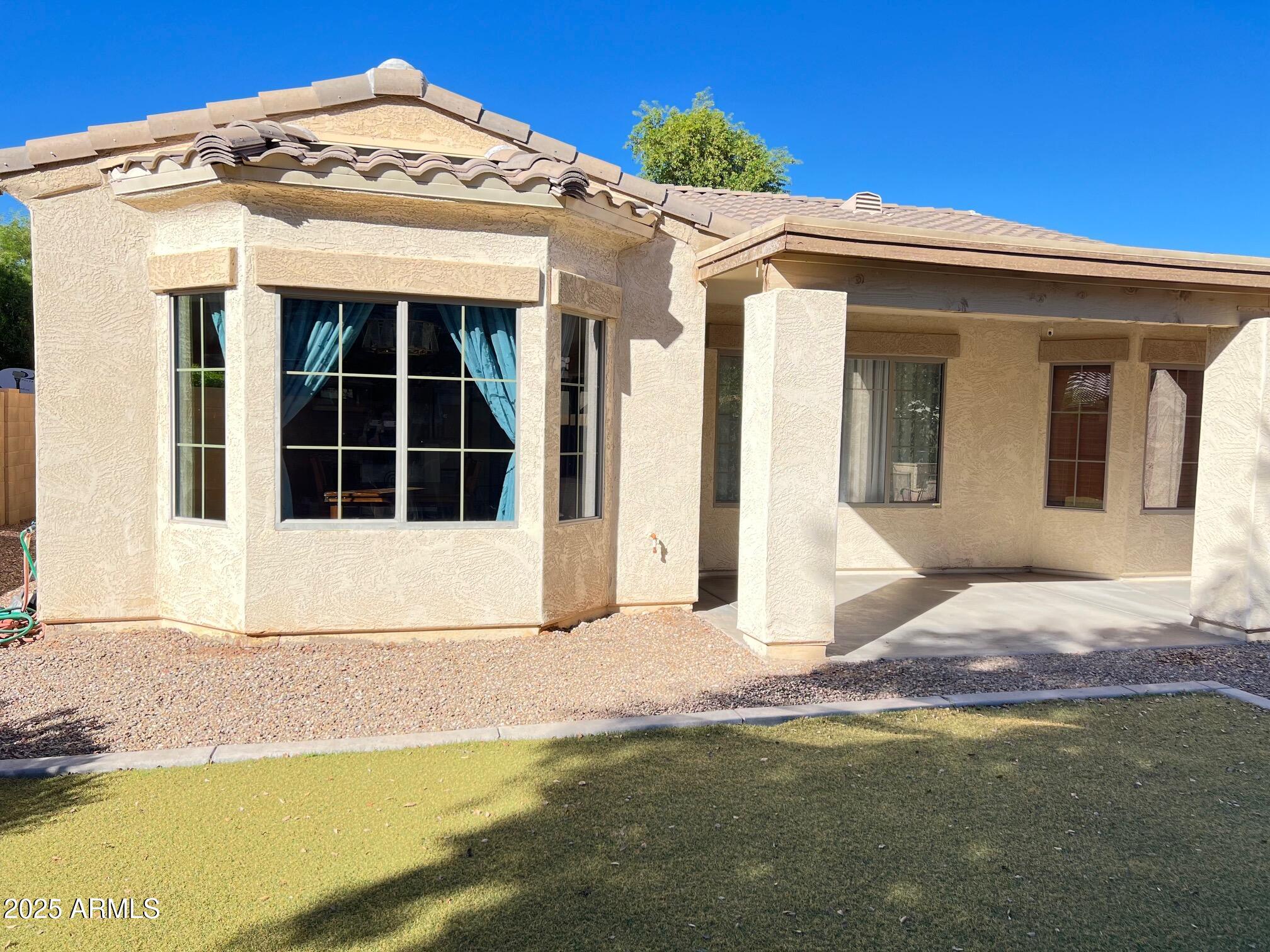 45353 West Sandhill Road Maricopa, AZ 85139 - Photo 15 of 20 a view of a house with a small yard