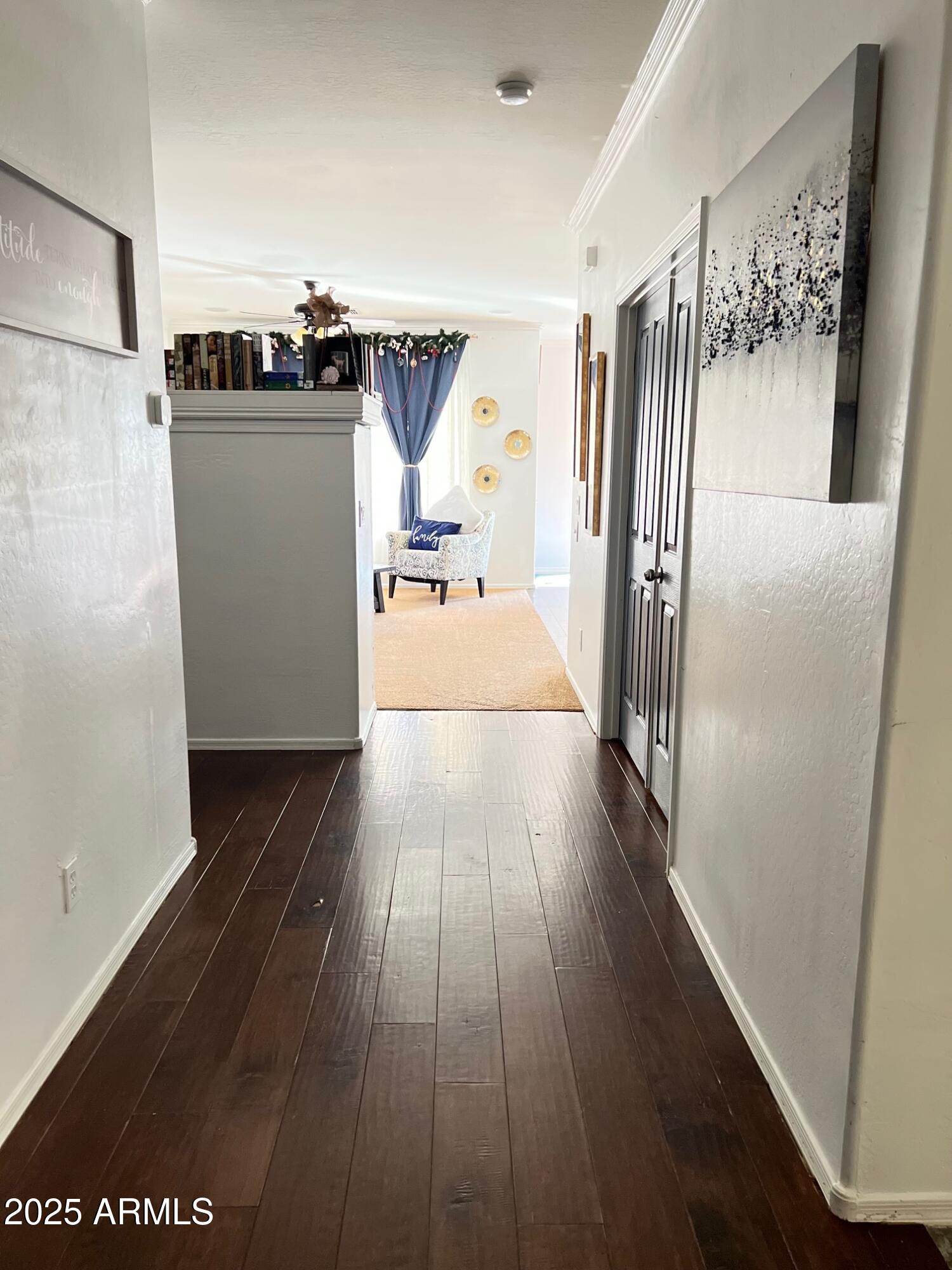 45353 West Sandhill Road Maricopa, AZ 85139 - Photo 5 of 20 a view of a hallway with wooden floor
