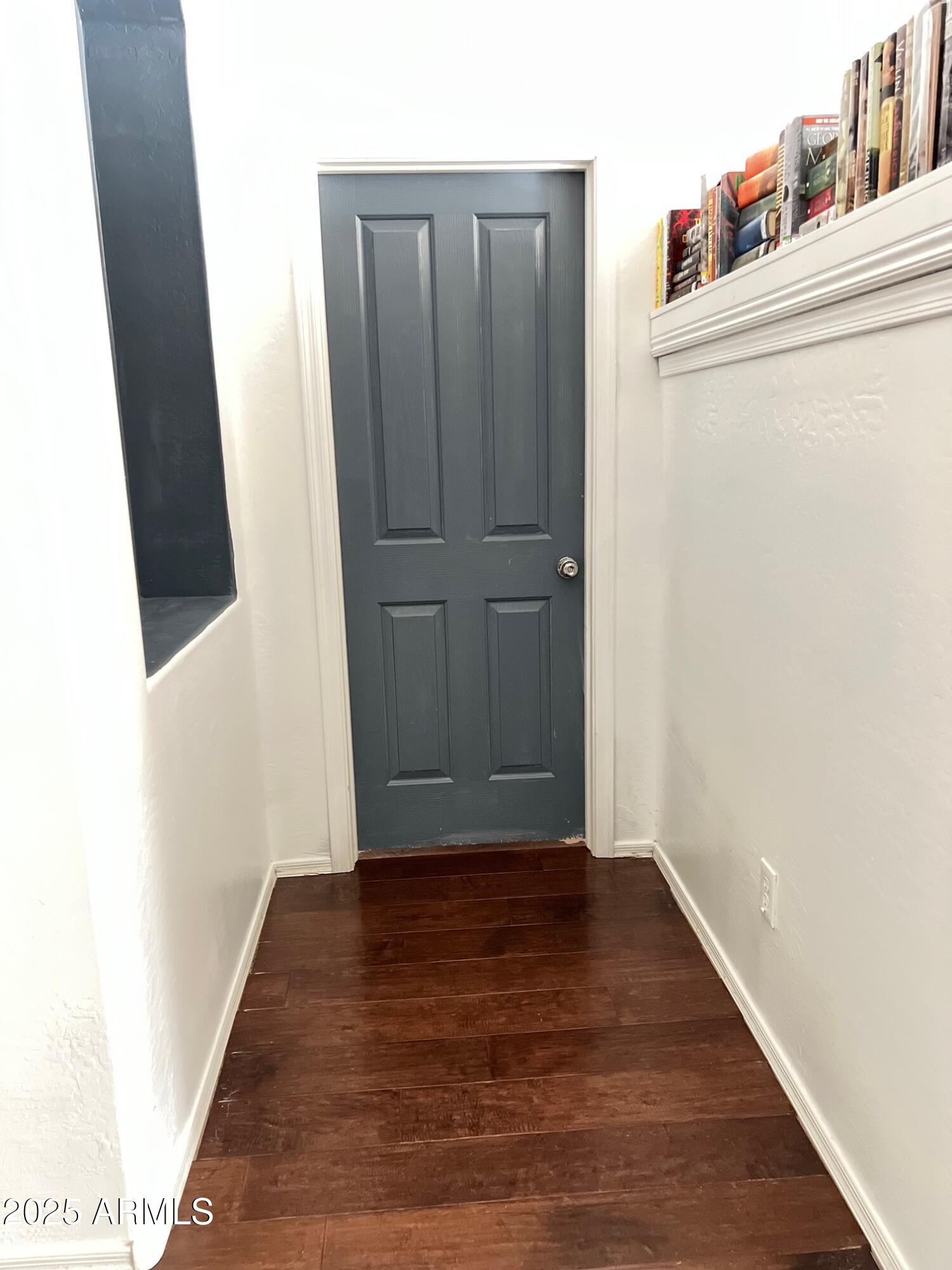 45353 West Sandhill Road Maricopa, AZ 85139 - Photo 6 of 20 a view of a hallway with wooden floor