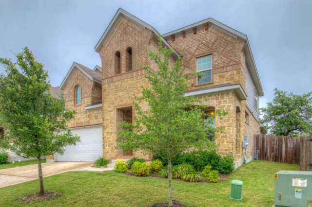 198 Stone View Trail Austin, TX 78737 - Photo 2 of 10 front view of a house with a yard