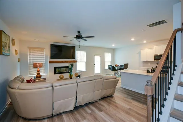 a living room with furniture fireplace and a flat screen tv