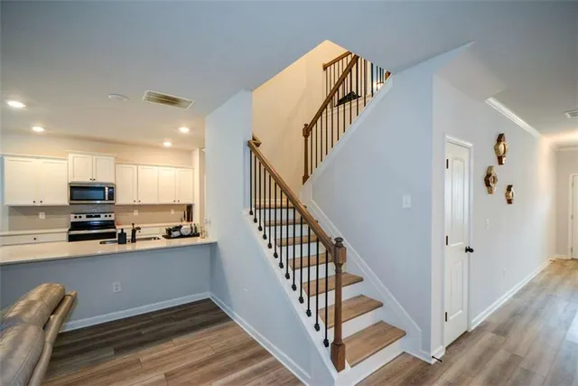 a bedroom with a bed dresser and a window