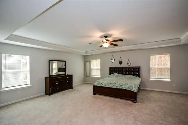 a view of a big room with windows and cabinet