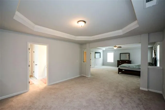 a walk in closet with lots of clothes