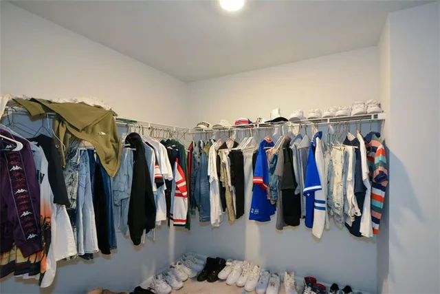 a view of storage and utility room with washer and dryer