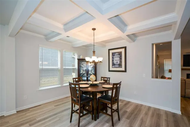 a dining room with furniture and window