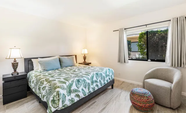 a bedroom with a bed and a couch