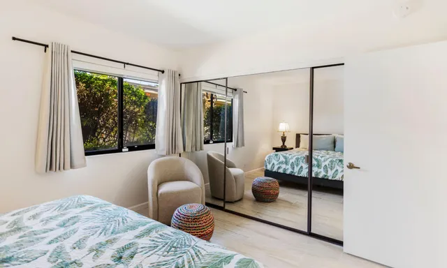 a bedroom with bed and window