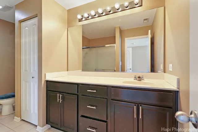 a bathroom with a double vanity sink and a mirror